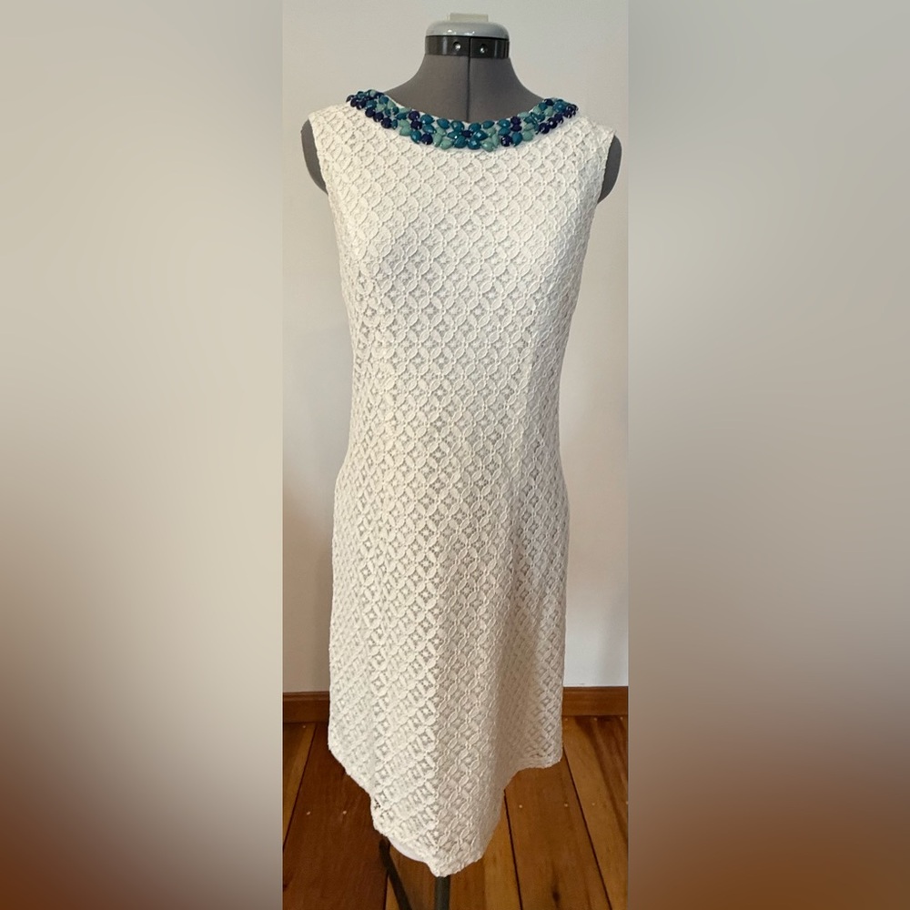 White lace dress with blue beaded neckline. Size 4.
